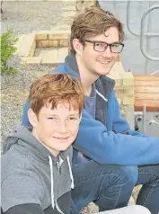  ??  ?? ST ANDREW’S BOYS: James, back, and his brother Cameron had a great seat at the Schools Boat Race