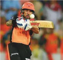  ?? AFP ?? Sunrisers opener Shikhar Dhawan plays a pull shot as the hosts chased down the target with nine wickets and 25 balls to spare.