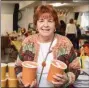  ??  ?? Sue DeLutis of Pottstown with two quarts of Tomato Bisque soup she’s taking home from the Holy Trinity Fall Bazaar.