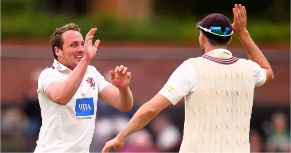  ?? PICTURE: Harry Trump/getty Images ?? Josh Davey celebrates after taking the wicket of Leicesters­hire’s Marcus Harris with Craig Overton during last week’s County Championsh­ip match