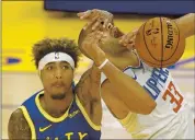  ?? EZRA SHAW — GETTY IMAGES ?? The Warriors’ Kelly Oubre Jr., left, fouls Nicolas Batum of the Clippers in a loss last week. Oubre has done little to show that he belongs in the team’s lineup so far this season.