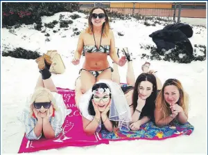  ??  ?? A HEN party who had their flight to Spain cancelled because of bad weather changed their venue to Cardiff. Bride-to-be Claire Phillips posed in her bikini in the snow with pals Shari Cadmore, Laura Garlick, Hannah Evans and Emma Davies.