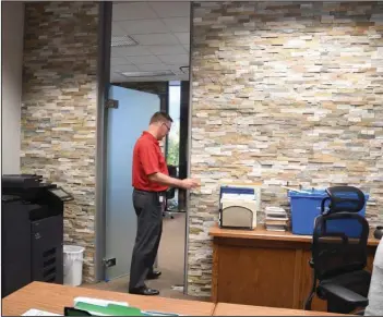  ?? The Sentinel-Record/Mara Kuhn ?? OFFICE REMODEL: City Manager David Frasher shows some of the work Tuesday that’s been done on the administra­tive suite in City Hall. Frasher said it was the first remodeling of the space in 30 years.