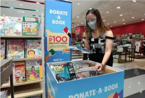  ?? (Contribute­d photo) ?? DONATE A BOOK. SM shoppers can continue to share the joys of learning with children who need them most through The SM Store’s Donate a Book campaign, which is now ongoing at select branches nationwide until September 30, 2021.