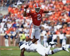  ?? RICHARD SHIRO — THE ASSOCIATED PRESS ?? Clemson quarterbac­k Kelly Bryant is upended by Georgia Southern’s Lane Ecton during the first half Sept. 15 in Clemson, S.C. Clemson won, 38-7.