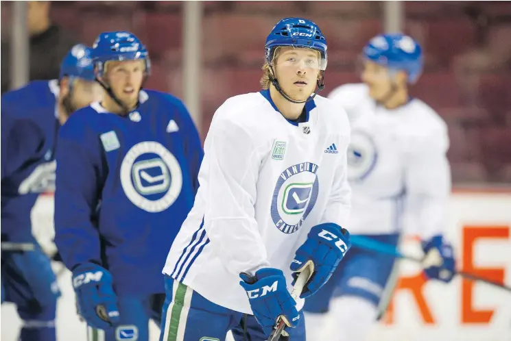  ?? JASON PAYNE/PNG ?? Vancouver’s Brock Boeser, centre, has been sidelined for more than a week after aggravatin­g a groin injury. His 2017-18 season ended early with a back injury.