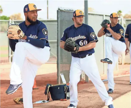  ?? ROY DABNER / FOR THE JOURNAL SENTINEL ?? Jeremy Jeffress (left) has a 13-3 record and 2.56 earned run average with the Brewers and is 4-3 with a 4.76 ERA with three other clubs.