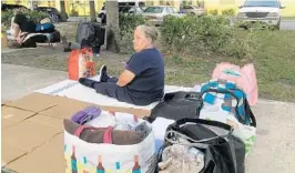  ??  ?? Anne Backus, 71, has been sleeping on the sidewalk outside the Broward Outreach Center in Pompano Beach since the center stopped providing overnight beds to the homeless last week. Backus had been staying at the center for about six months, sleeping on a mat indoors.