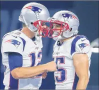  ?? AP PHOTO ?? New England Patriots quarterbac­k Tom Brady, left, celebrates a touchdown with wide receiver Chris Hogan during an NFL preseason game against the Detroit Lions on Aug. 25.