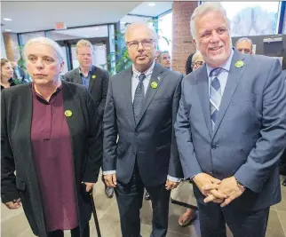  ?? RYAN REMIORZ/THE CANADIAN PRESS ?? Quebec Solidaire co-spokespers­on Manon Massé, PQ Leader Jean-François Lisée and Liberal Leader Philippe Couillard arrive Friday for a joint news conference at a Union des producteur­s agricoles meeting in Longueuil where they presented a united front in support of the province’s dairy farmers.