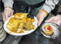  ??  ?? Turkey, mashed potatoes and all the fixins, along with dessert, made up the hearty Thanksgivi­ng meals.