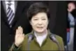  ?? LEE JIN-MAN - THE ASSOCIATED PRESS ?? In this 2013 photo, South Korea’s President Park Geun-hye takes an oath during her inaugurati­on ceremony at the National Assembly in Seoul, South Korea. A day after a court removed her from power over a corruption scandal, Park maintained her silence...