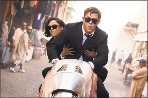  ?? Giles Keyte / TNS ?? Tessa Thompson and Chris Hemsworth in “Men in Black: Internatio­nal.”