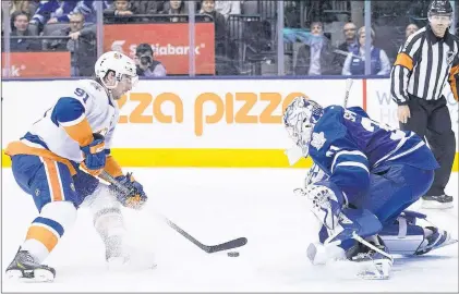  ?? CP PHOTO ?? Toronto Maple Leafs goalie Garret Sparks stops New York Islanders’ John Tavares in a shootout to win the game in Toronto in 2015.
