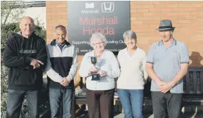  ??  ?? PERFECT PAIRS ... Eastfield Bowling Club president Moira Audsley, centre, prepares to present the club’s drawn pairs winners’ trophy to, from left, Phil Todd and Pete Richards, with, right, runners-up Jenny Richards and Ray Leeman