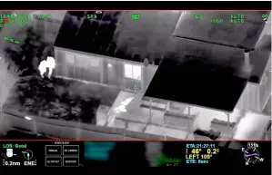  ??  ?? Clark is visible on the ground after two police officers (left) shot him, in this still image captured from police aerial video footage released by Sacramento Police Department. — Reuters photo