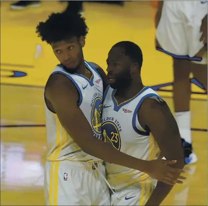 ?? JEFF CHIU — THE ASSOCIATED PRESS ?? Warriors rookie center James Wiseman, left, and forward Draymond Green are learning to work together, and it’s not always smooth.