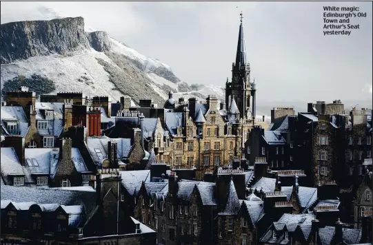  ??  ?? White magic: Edinburgh’s Old Town and Arthur’s Seat yesterday