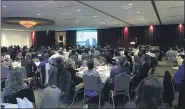  ?? NEWS-HERALD FILE ?? The audience at the 2018 Lake-Geauga Fast Track 50 dinner and awards program watches video presentati­ons featuring the event’s Top 5 Establishe­d Companies.