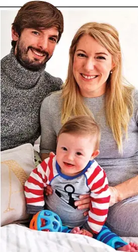  ??  ?? ‘Perfect’: One-year-old Theo with parents Claire and Andrew