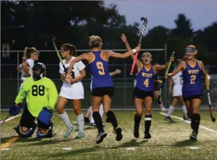  ?? BILL RUDICK — FOR DIGITAL FIRST MEDIA ?? Downingtow­n West celebrates a goal by Tatum Johnson Tuesday night against Conestoga.