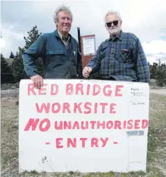  ?? PHOTO: MARK PRICE ?? Clearing the way . . . Graham Taylor and Jim Bryson are two of the Luggate residents carrying out working bees to improve the recreation reserve next to the Red Bridge.