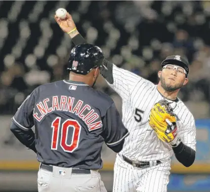  ?? | NAM Y. HUH/ AP ?? White Sox second baseman Yolmer Sanchez throws to first after forcing out Edwin Encarnacio­n in the fourth inning.