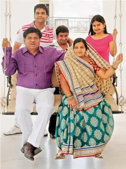  ??  ?? SWINGING TIME: Sohanlal Pokarna with wife Shantabai, (behind) sons Mukesh, Bharat and daughter Usha