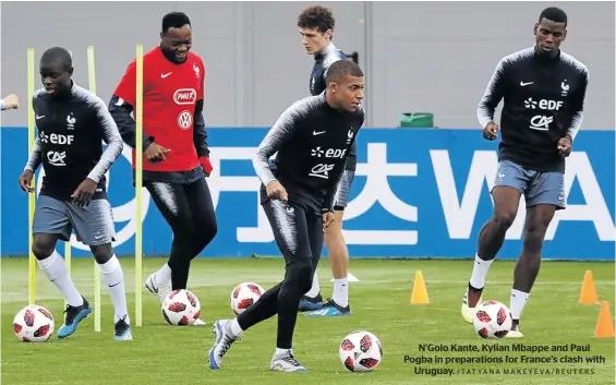  ?? /TATYANA MAKEYEVA/REUTERS ?? N’Golo Kante, Kylian Mbappe and Paul Pogba in preparatio­ns for France’s clash with Uruguay.