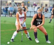  ?? BARRY TAGLIEBER — FOR DIGITAL FIRST MEDIA ?? Merion Mercy’s Katie Murphy, left, and Phoenixvil­le’s Gabrielle Herschell try to establish control of the ball Friday.