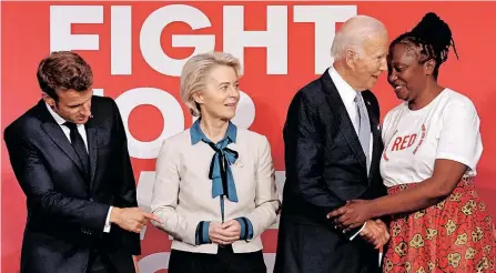  ?? ?? FRENCH President Emmanuel Macron and EU Commission President Ursula von der Leyen look on as US President Joe Biden shakes hands with Ambassador and AIDS activist Connie Mudenda at the Global Fund’s Seventh Replenishm­ent Conference in New York City this week. The Global Fund’s Seventh Replenishm­ent Conference brings together government­s, civil society, and the private sector to take action in the fight against HIV/AIDS, tuberculos­is and malaria. | AFP