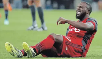 ?? ASSOCIATED PRESS FILE PHOTO ?? Toronto FC's Jozy Altidore grimaces in pain during the CONCACAF Champions League final soccer match against Chivas in Guadalajar­a, Mexico, on April 25.