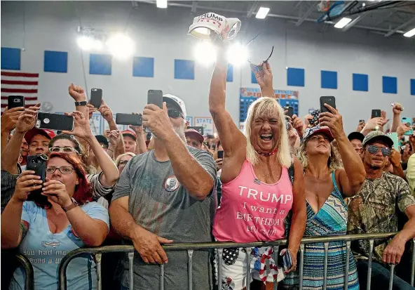  ?? AP ?? The crowd cheers as President Donald Trump arrives to speak at a rally at Olentangy Orange High School in Lewis Center, Ohio.