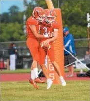  ?? AUSTIN HERTZOG - DIGITAL FIRST MEDIA ?? Perkiomen Valley quarterbac­k Cole Peterlin is congratula­ted after rushing for a long touchdown last season against Downingtow­n West.