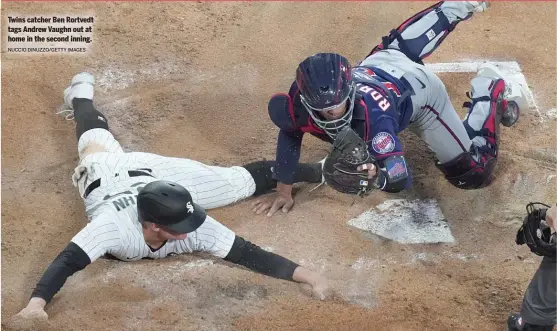  ?? NUCCIO DINUZZO/GETTY IMAGES ?? Twins catcher Ben Rortvedt tags Andrew Vaughn out at home in the second inning.
SPORTS