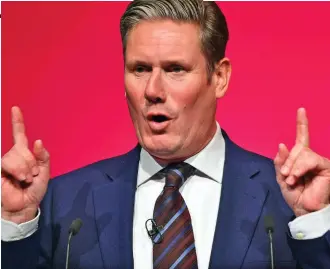  ??  ?? Gleamy-eyed obsessive: Keir Starmer at yesterday’s party conference