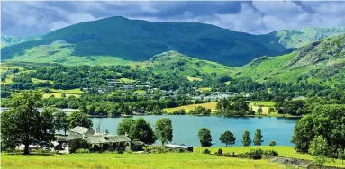  ?? ?? Benevolent giant: Mountain hikes of the Old Man offer breathtaki­ng views of Coniston Water