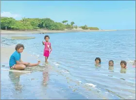  ?? ?? Children from Yavulo Village enjoying their afternoon swim at Naqarai beach.