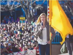  ?? ADOLPHE PIERRE-LOUIS/JOURNAL ?? Holly Holm speaks at a packed Civic Plaza after a Dec. 6 parade for the UFC women’s bantamweig­ht champion in Albuquerqu­e.