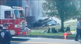  ?? Nicholas Rondinone/Hearst Connecticu­t Media ?? First responders at the scene of a fire caused by a plane crash on Hyde Road at the Trumpf facility in Farmington on Thursday.