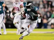  ?? Mitchell Leff/Getty Images ?? Eagles receiver A.J. Brown carries the ball against the Giants during the first half on Jan. 21 in Philadelph­ia.