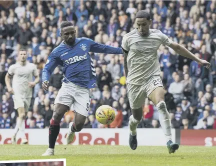  ??  ?? 2 Max Lowe tussles with Jermain Defoe in Sunday’s 2-0 defeat at Ibrox, a game the Englishman described as ‘frustratin­g’. Inset, Lowe shakes hands with Scott Brown after Aberdeen’s Scottish Cup semi-final defeat by Celtic earlier this month.