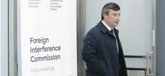  ?? ADRIAN WYLD, THE CANADIAN PRESS ?? Michael Chong leaves the public inquiry Into foreign interferen­ce after giving evidence this month.