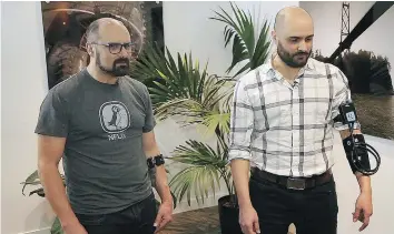  ??  ?? The SymPulse Tele-Empathy Device developed by Toronto’s Klick Labs was worn by identical twins Jim Smerdon, left, and his brother Pat.