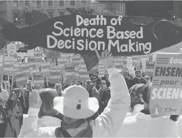  ?? SEAN KILPATRICK/THE CANADIAN PRESS ?? Scientists and supporters rally on Parliament Hill in September as part of demonstrat­ions across the country calling on the federal government to stop cutting scientific research and muzzling its scientists.