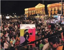  ?? SALVADOR MELENDEZ THE ASSOCIATED PRESS ?? People watch live TV images from the Vatican where El Salvador’s martyred Salvadoran Archbishop Óscar Romero is declared a saint.