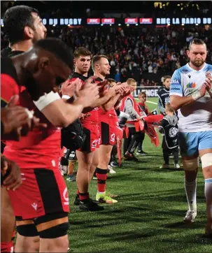  ?? ?? A disappoint­ed Ryan Wilson leads Glasgow off the pitch after losing to Lyon