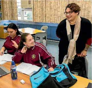  ?? PHOTO: DAVID UNWIN/STUFF ?? Greens co-leader Metiria Turei stopped to talk with Tanika Jeffery, 14, who was learning speech writing in te reo, at Queen Elizabeth College.