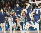  ?? YOUNG KWAK/AP ?? Yale, celebratin­g after its win over Auburn in the NCAA Tournament, was the latest to prove all is right with the NCAA Tournament.