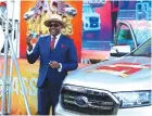  ?? ?? OK Zimbabwe Limited CEO Mr Maxen Karombo shows off keys of the Ford Ranger twin cab won by Prosper Zambuko of Kwekwe